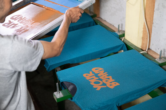 Freshly screen printed tshirt with the words "Your Brand"